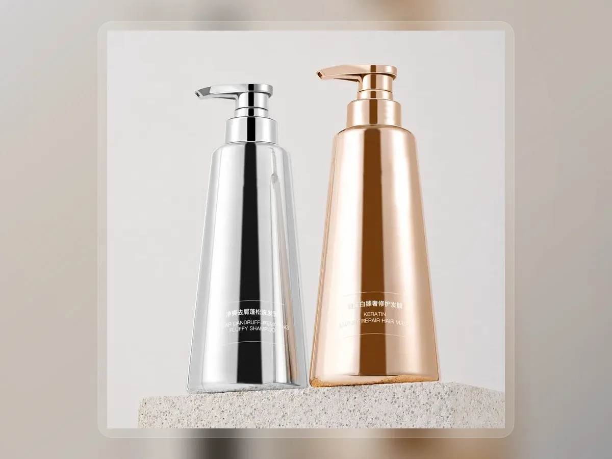 Silver and copper botanical shampoo pump bottles on premium extended background