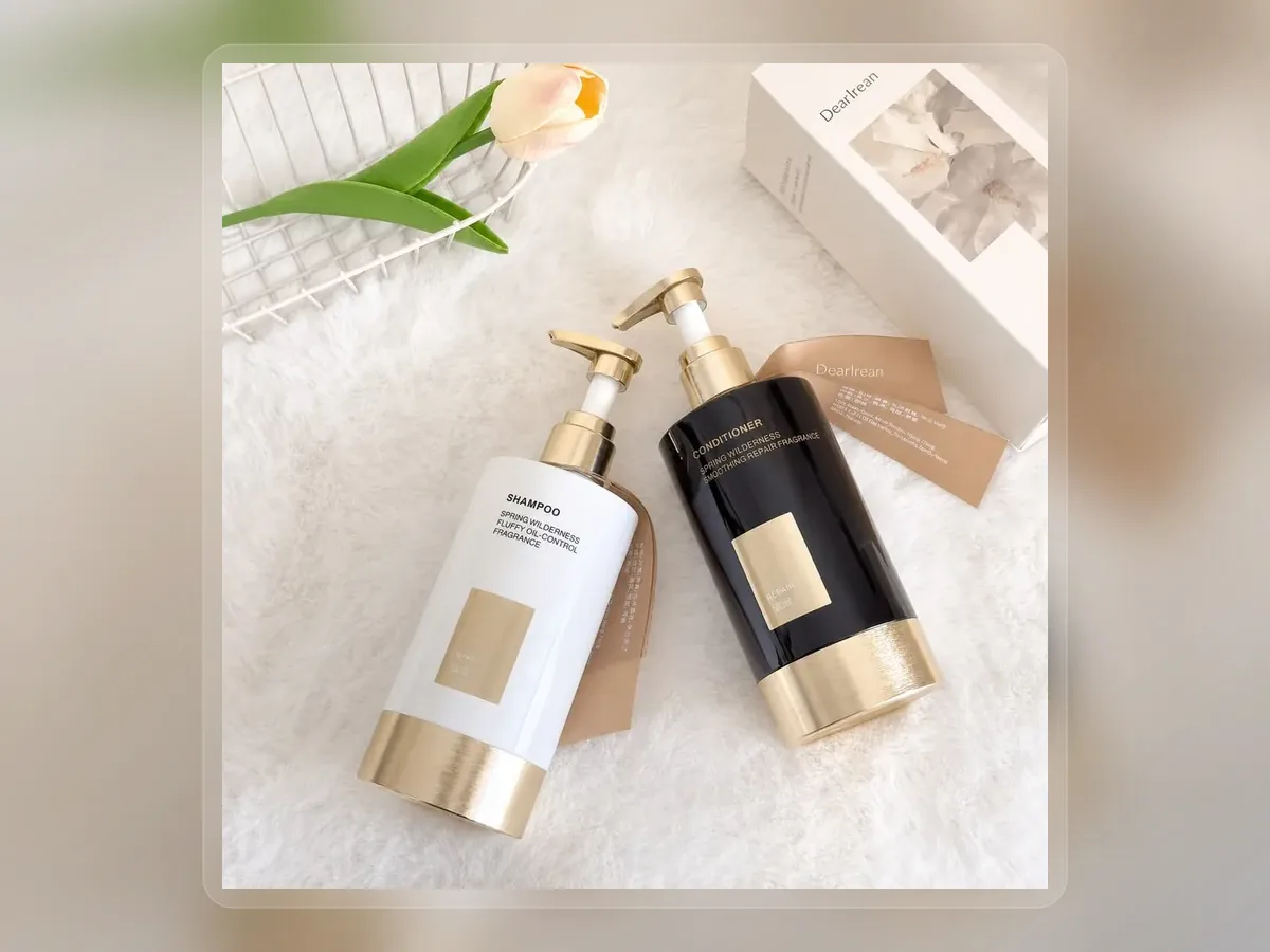 Black and white volumizing shampoo pump bottles in bright setting on premium extended background