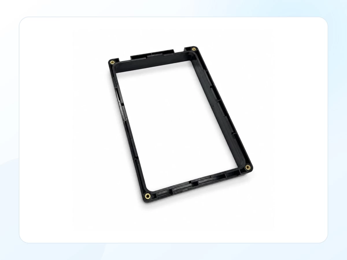Black medical equipment display bezel with large rectangular opening with key product features