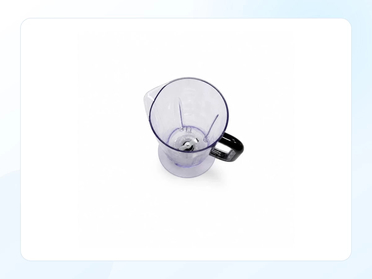 Transparent blender mixing cup with black handle viewed from above with key product features