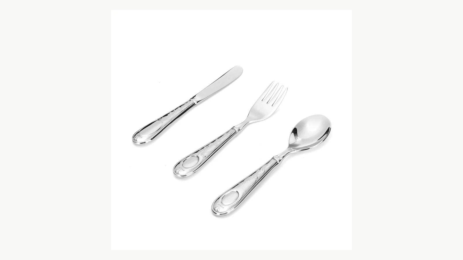 Medallion handle detail across knife fork and spoon pieces