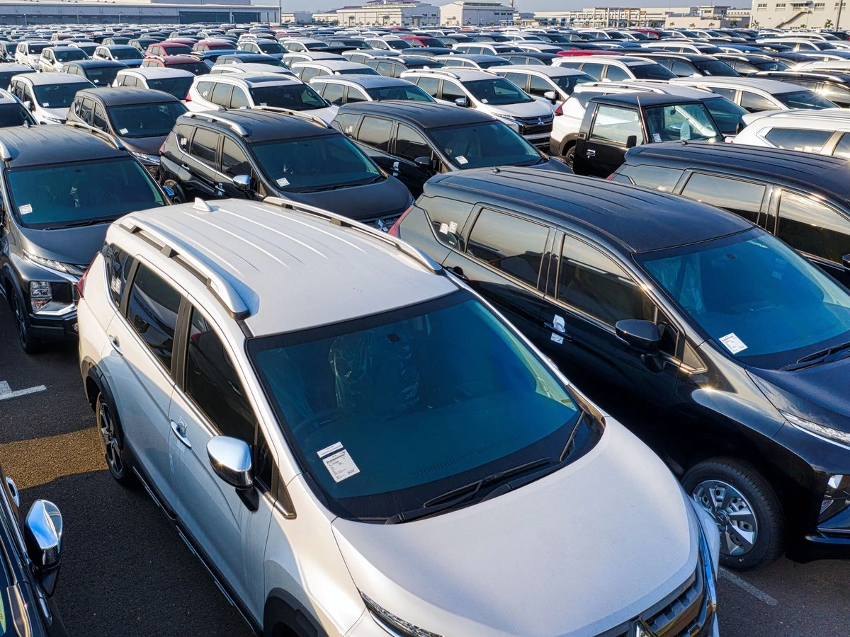 Buyer Walking Through Used Car Dealership