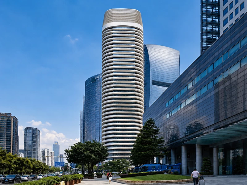 Rounded high-rise building with horizontal architectural aluminum cladding bands