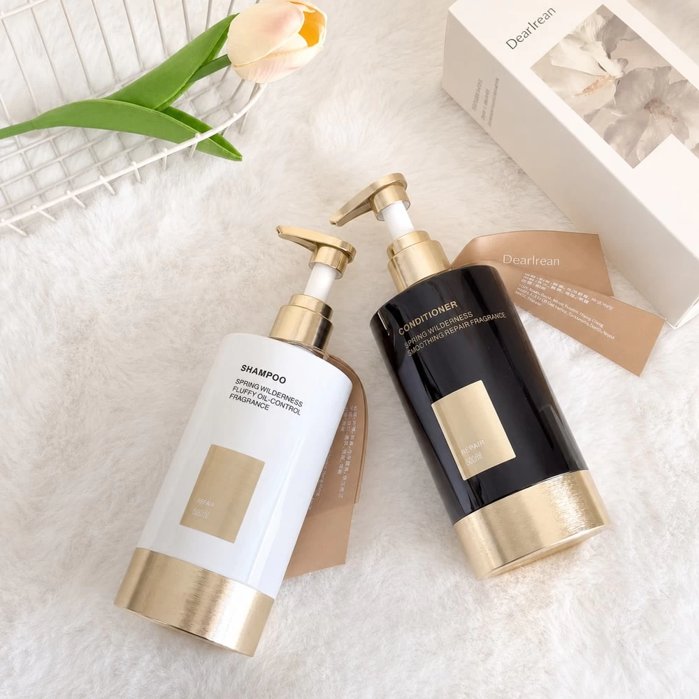 Black and white volumizing shampoo pump bottles in bright setting