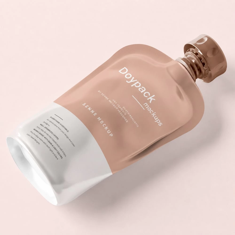 Soft pink botanical hair dye squeeze bottle on pale background