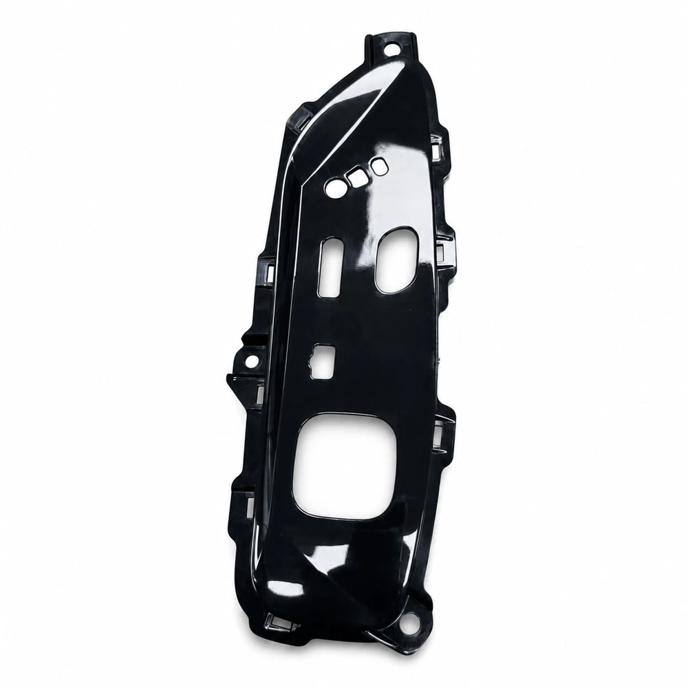 Rear side of automotive control panel carrier with mounting features