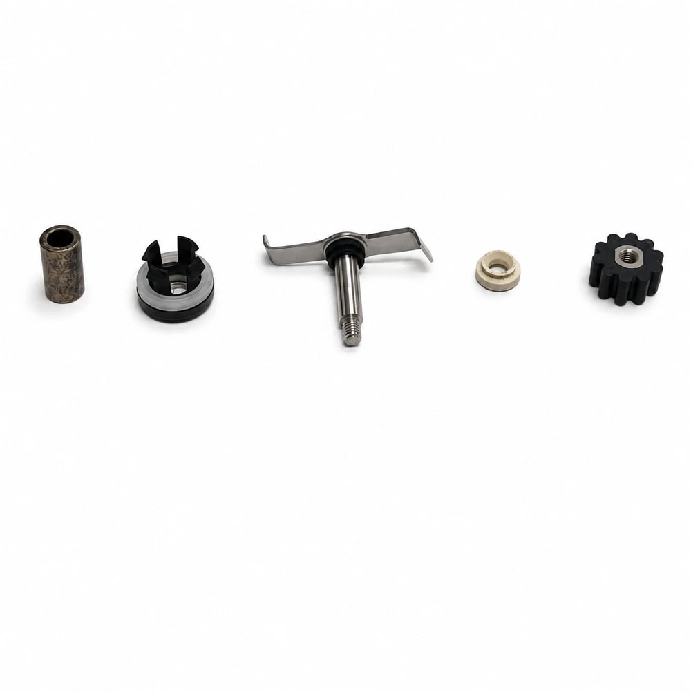 Assorted hardware inserts and small mechanical components on white background