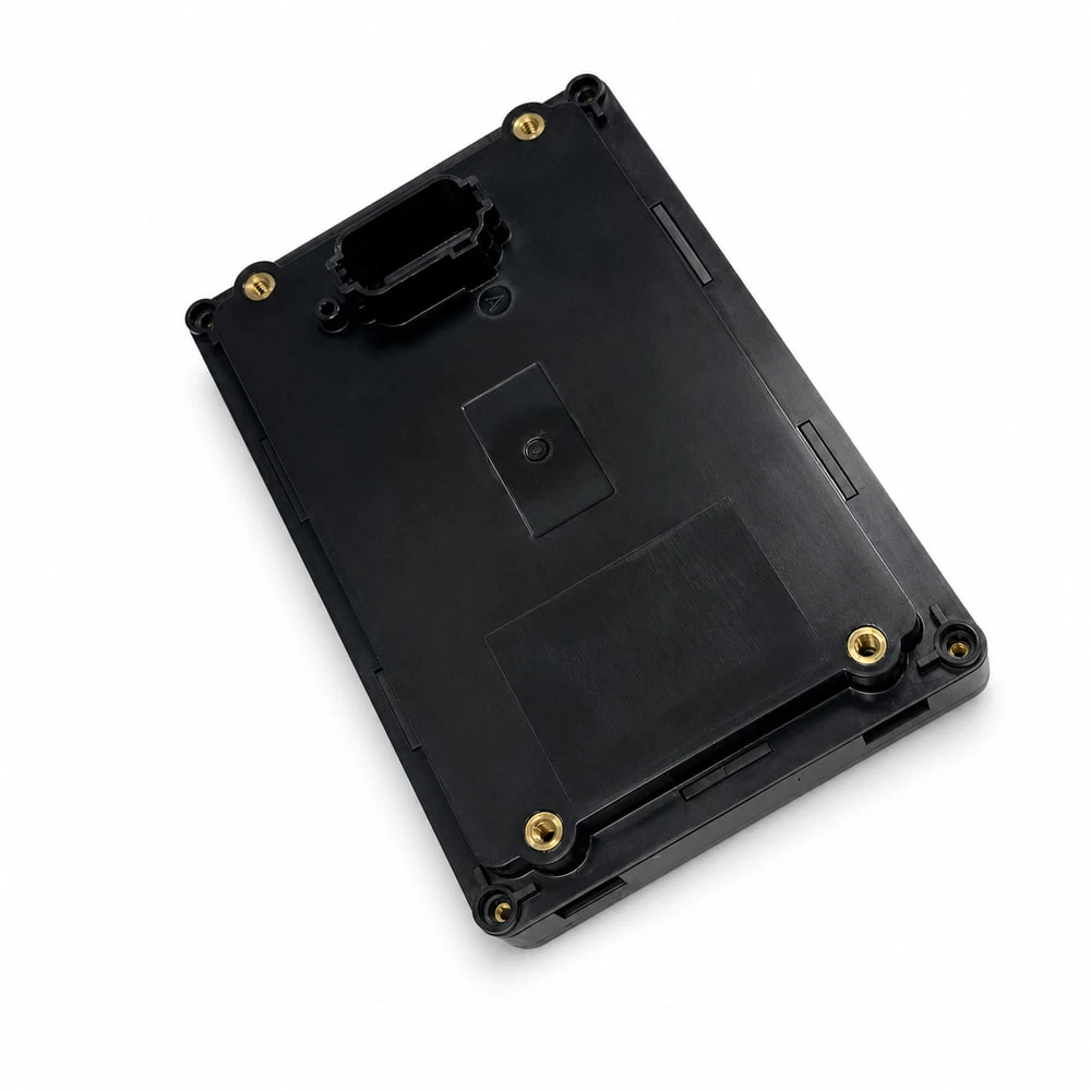 Rear medical device housing with threaded inserts and connector port