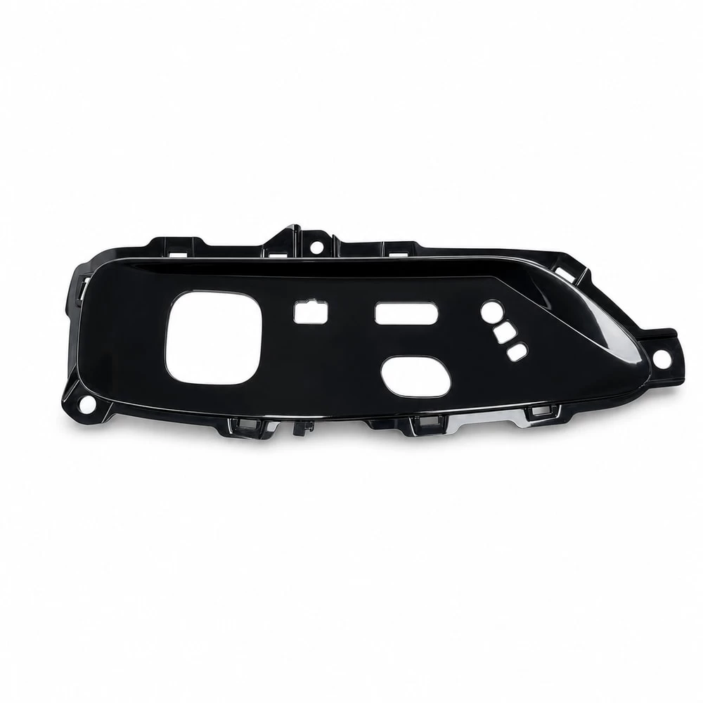 Black passenger seat control panel carrier with switch openings