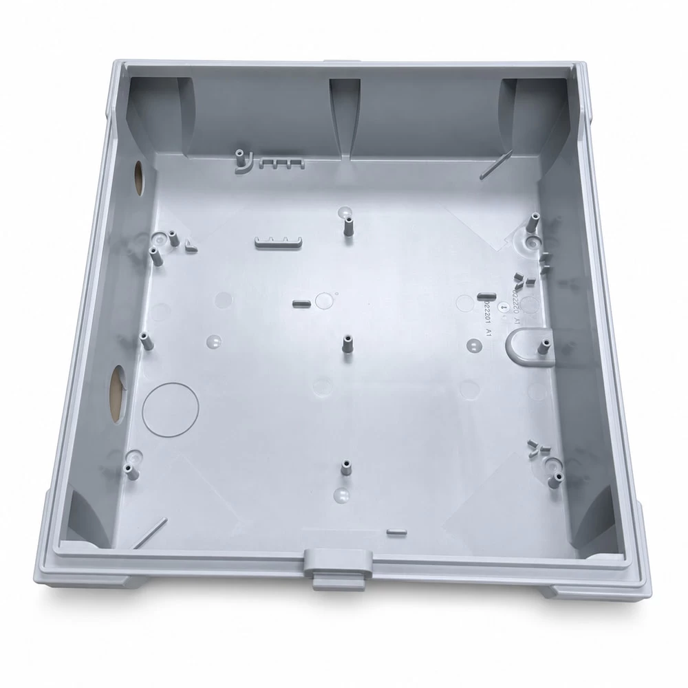 Electrical enclosure base showing internal ribs and interface openings