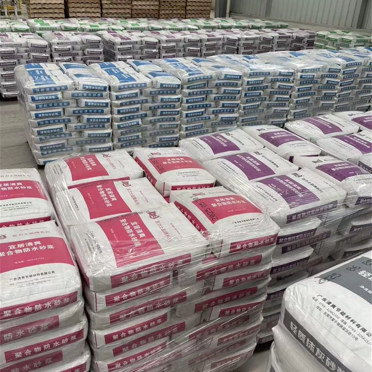 Warehouse stock of red and blue polymer waterproofing mortar bags square primary view