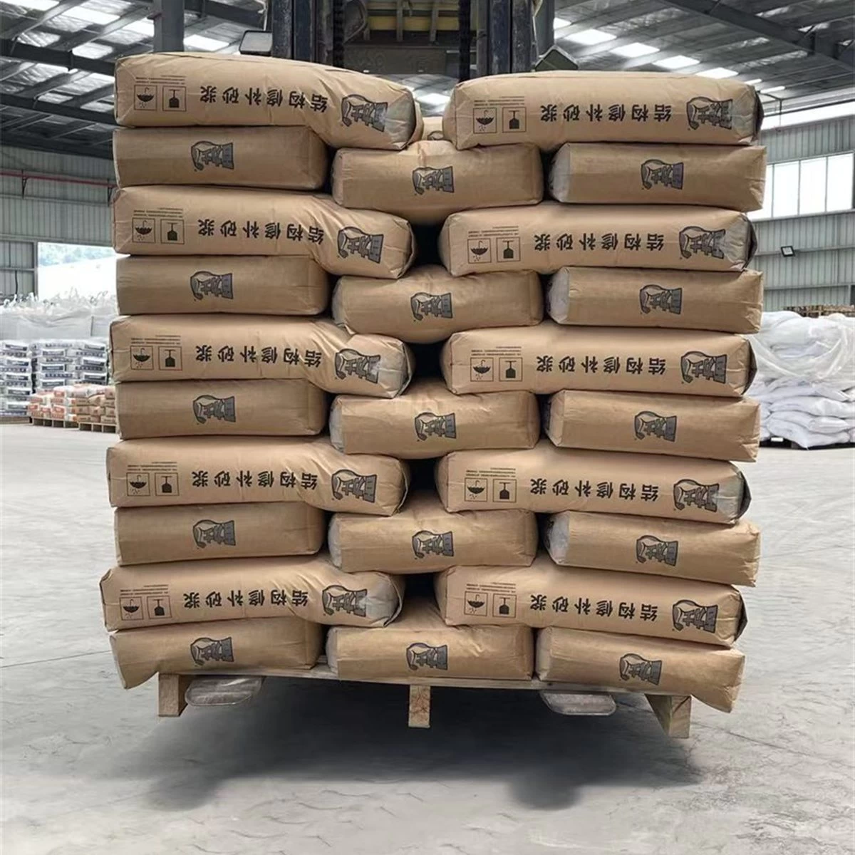 Pallet of structural repair mortar bags inside a warehouse square primary view