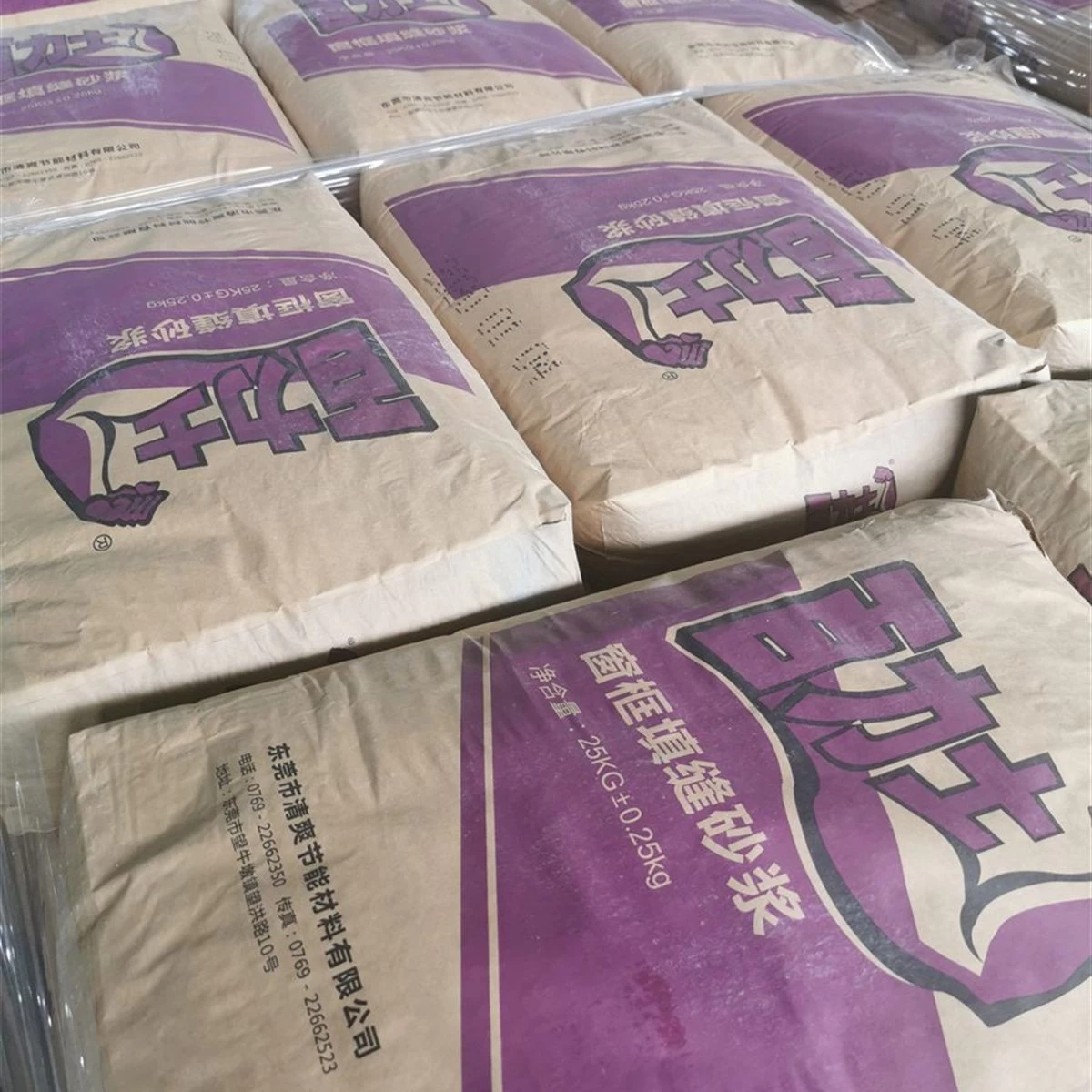 Purple bags of window frame gap filling mortar in warehouse storage square primary view