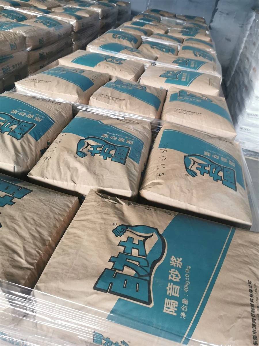 Blue bags of sound insulation mortar stacked for project delivery