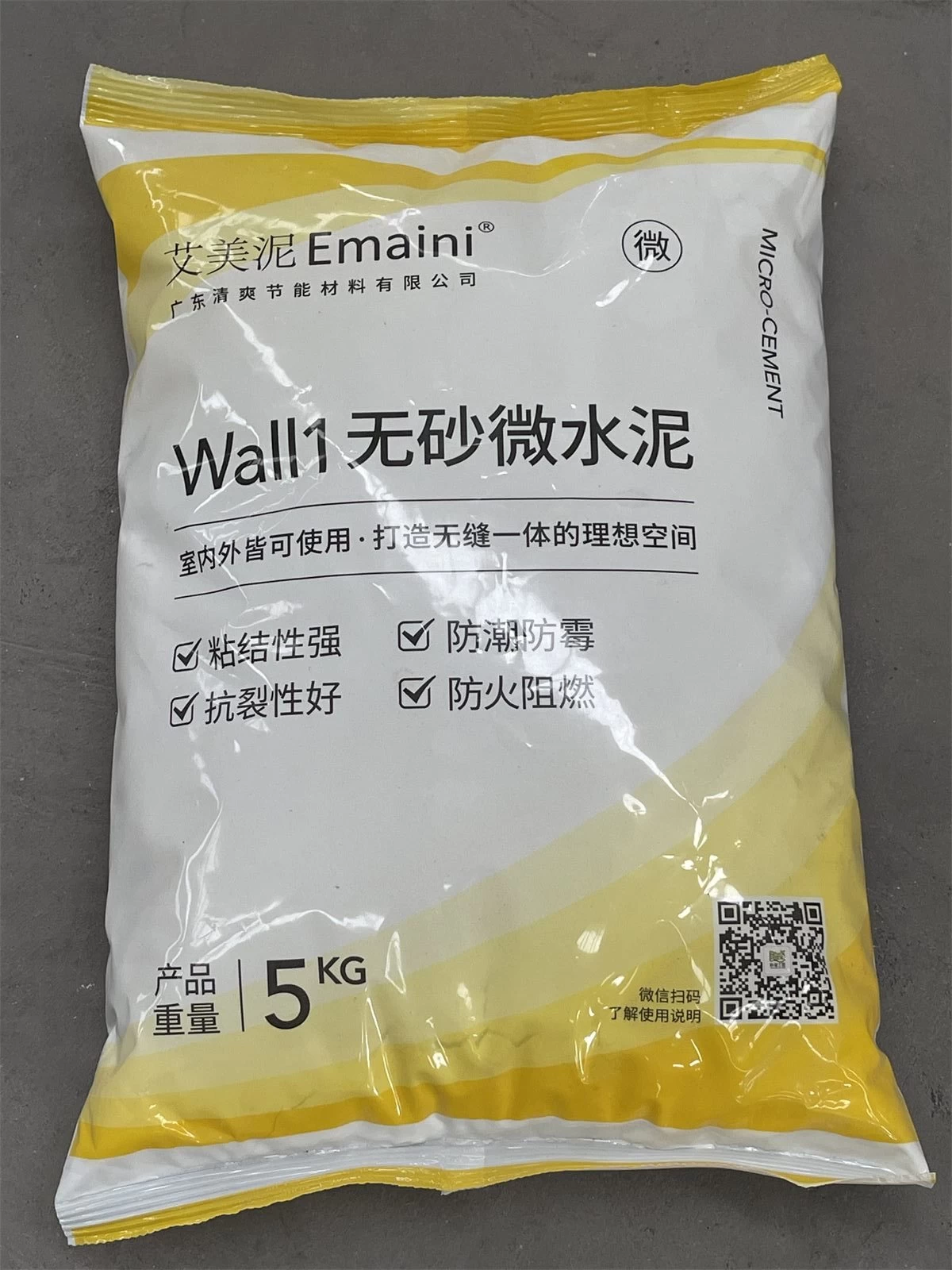 Yellow and white bag of decorative microcement finish material