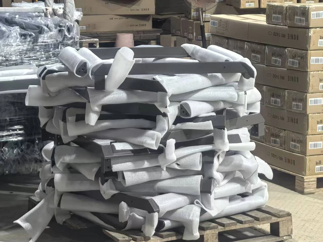 Furniture frames individually separated with foam and stacked on a pallet