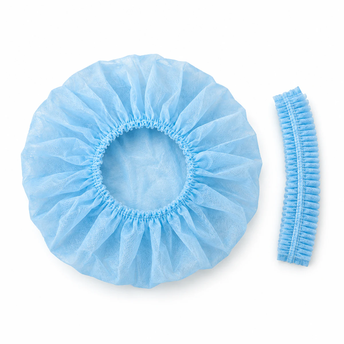 Blue nonwoven cap shown expanded beside its folded strip form